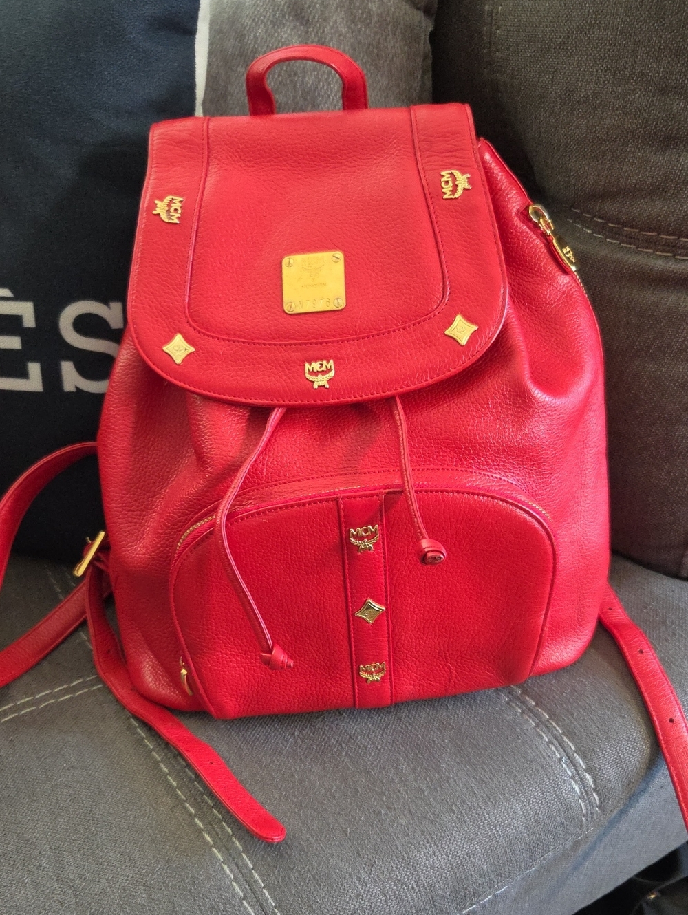 MCM Red Pebbled Leather Drawstring Backpack with Gold Hardware